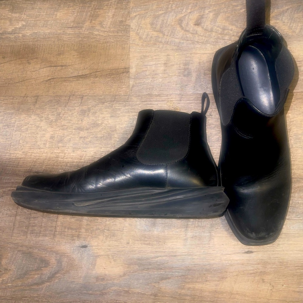 Alexander McQueen glossed-leather exaggerated-sole Chelsea boots.